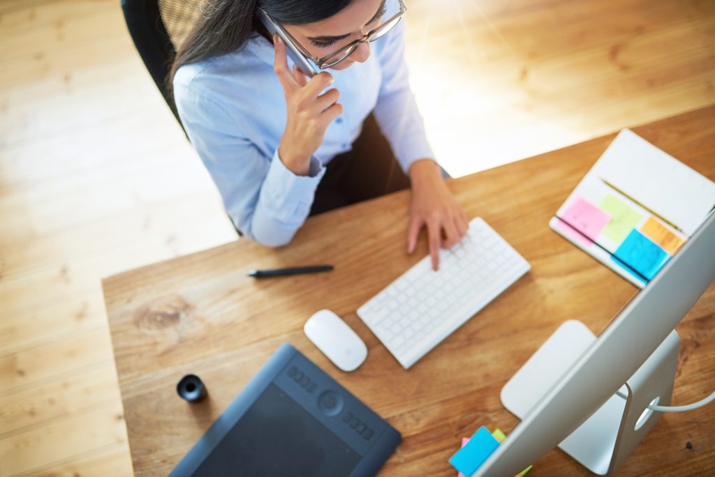 Young businesswoman taking a mobile call