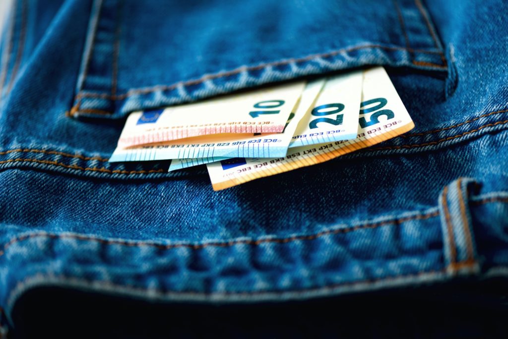 Euro banknotes in jeans pocket. Success, wealth and poverty, poorness concept. Euro currency
