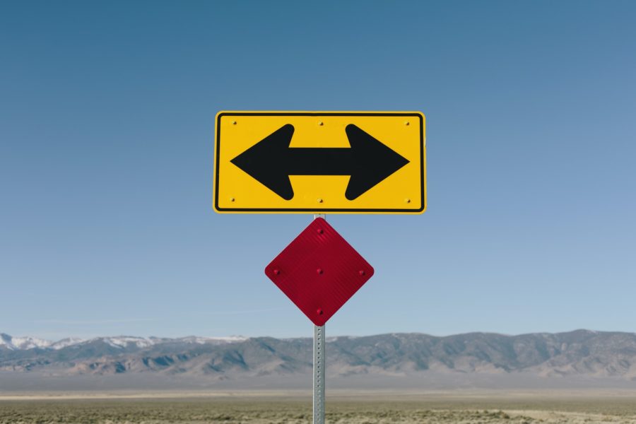 Directional arrow sign along rural road near Orvada.